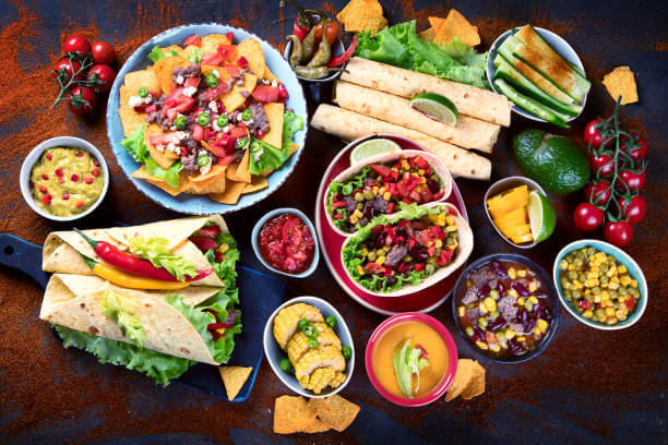 Traditional Mexican food mix on dark background. Top view